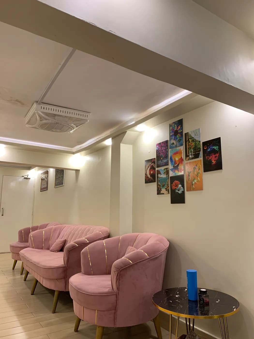 Waiting area with pink velvet chairs